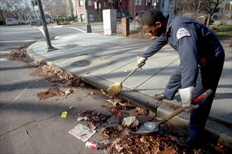 May 6, 1996 - man cleaning a city street the old fashioned way, with a broom