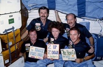 The five-member crew celebrates a successful mission
