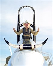 Ed Schneider gives a 'thumbs-up' after his last flight at the Dryden Flight Research Center