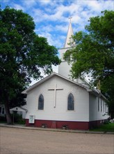 Paul's Lutheran Church (1914) raises a pretty white steeple to the sky in Kathryn.