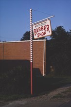 1980s America -  Whitlock's Barber Shop sign