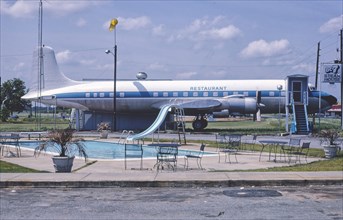 1980s America -  DC-7 Steak House with airplane next to swimming pool, Byron, Georgia 1982