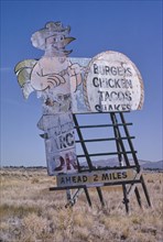 1990s America -  Chicken cowboy billboard, Elko, Nevada 1991