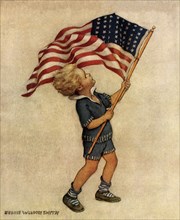 Boy waving American Flag.