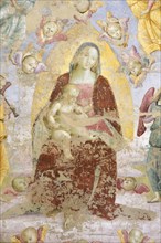 Panicale (Italy, Umbria, province of Perugia), Church of San Sebastiano. Madonna and Child, Musician Angels and Saints Augustine and Mary Magdalene, attribution to Raffaello Sanzio, fresco, around 150...
