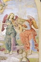 Panicale (Italy, Umbria, province of Perugia), Church of San Sebastiano. Madonna and Child, Musician Angels and Saints Augustine and Mary Magdalene, attribution to Raffaello Sanzio, fresco, around 150...