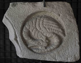Voussoir with a relief depicting a dragon