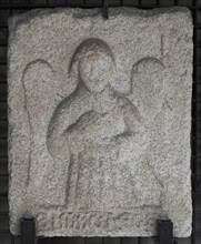 Stone slab showing an angel symbolizing Saint Matthew