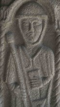 Bas-relief sculpture depicting a pilgrim