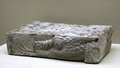 Fragment of baked clay brick, moulded and unglazed