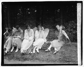 TitleCross Triumphant, 5/10/22SummaryPhotograph shows performers taking a cigarette break during The Cross Triumphant pageant at the Episcopal Cathedral. (Source: researcher A. Walker, 2021 and The Ev...