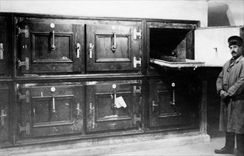 italy, the morgue, drawers for preservation of corpses, 1920-30