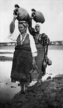 Going to the well. albania. 1920