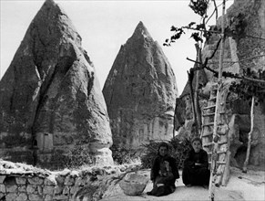 Turkey. cappadocia. two women in front of their homes. 1954