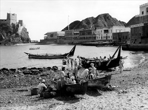 Oman. Muscat. the harbor bay with the Portuguese fort of Jalali on the left. 1957