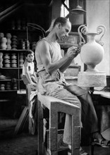 Italy. marche. pesaro. craftsman in the pottery workshop. 1955