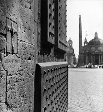 Rome. Porta del Popolo with the plaque of the jubilee 1725. 1950