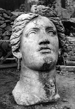 Head of a goddess at the sacred area of largo di torre argentina. rome. 1940-50