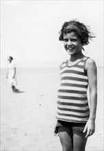 Tuscany. Grosseto. Portrait Of A Little Girl At The Beach. 1920