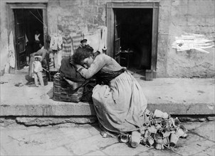 Italy. Campania. Napoli. Street Vendor Sleeping. 1900-1910