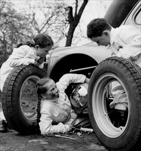 Road Safety Education. Children Replace A Tire. 1967