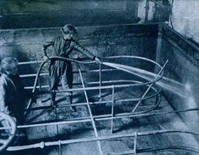 Cleaning brewery vats at Burton-on-Trent.