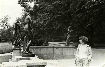 A young woman considering a sculpture park at Peterhof.