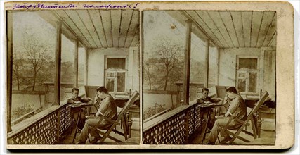 A stereo, a man with a boy playing checkers on the porch at home.