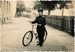 Captain of the Soviet Army with bicycle.