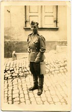 Soviet Army lieutenant, standing on the street.