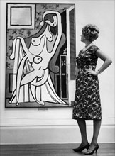 Visitor admires a picasso at the London gallery.