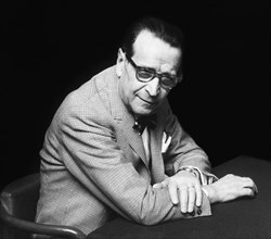 The writer georges simenon during a press conference.