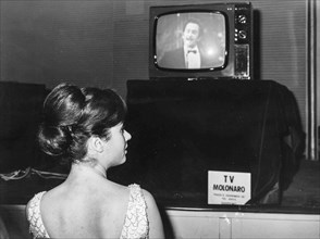 Gigliola Cinquetti Observes Domenico Modugno On Television.