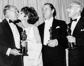 Jack Warner, Audrey Hepburn, Rex Harrison, George Cukor and Oscar.