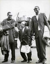 Harold Lloyd Between Two Players Of The Harlem Globetrotters.