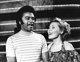 Lulu Kennedy Cairns and Johnny Mathis.