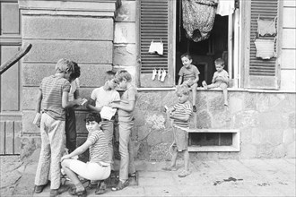 Italy, boys playing in the street, 1970