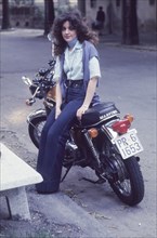 Young woman on motorbyke, 70's
