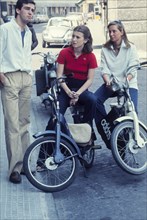 Three young people on motorcycle, 80's