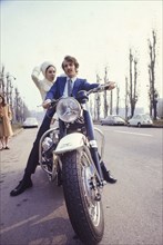 Bride and groom on motorbyke, 70's