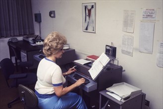 Secretary with typewriteter, 70's