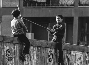 Children playing on a wall, 70's