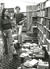 Young people in a used books store, milan, 60's