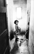 Child in the albergo dei poveri in charles III square, naples, 70's