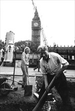 Workers in a road yard near big ben, london, uk, 70's