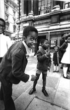 Black children in a street of london, uk, 70's