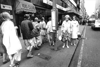 People walking in oxford street, london, uk, 70's