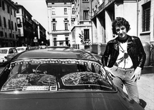 Young man with his car, turin, 70's