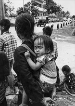 Laos, luang prabang, mother and child during a military parade, 70's