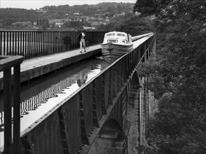 Canal barge crossing Telford's Pontcysyllte viaduct, near Llangollen, Wales, uk, 80's